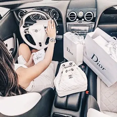 Bentley Chanel bag Dior shopping bags