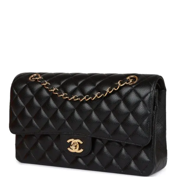 Chanel Medium Classic Double Flap Bag Black Caviar Gold Hardware in black.