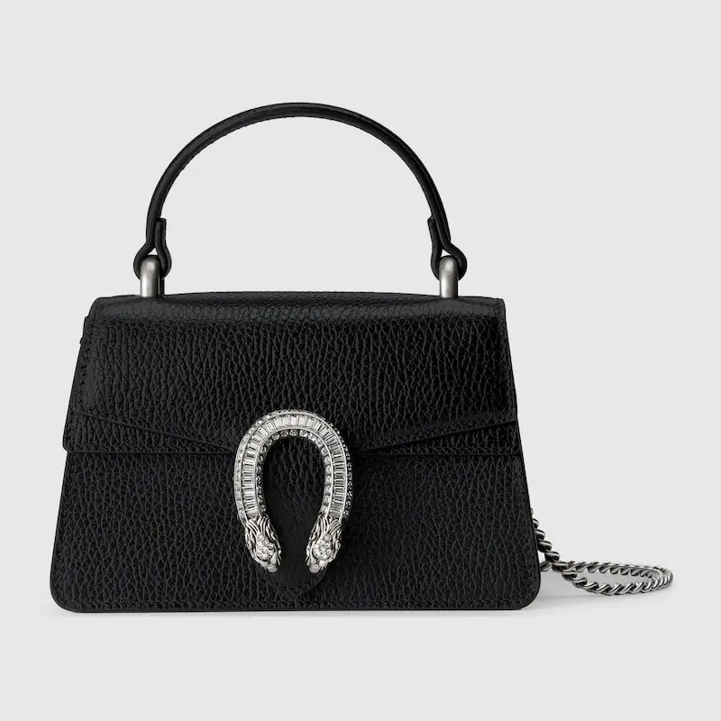 The Dionysus mini top handle bag is black and has a chain on it.