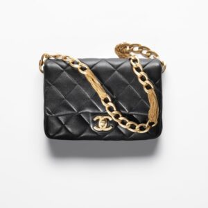 Chanel small black flap bag with gold chain.